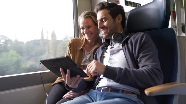couple traveling in a train