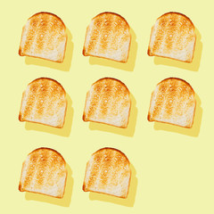 Photography collage of toasted bread on pastel yellow background top view flat lay isometric food pattern.Modern trendy pop-art style.Breakfast concept.Square image