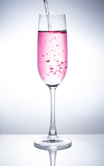 A glass of wine to add water.