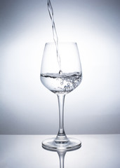 A glass of wine to add water.