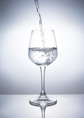 A glass of wine to add water.