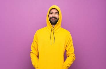 Happy Handsome man with yellow sweatshirt
