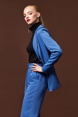 Beautiful sexy woman wear for meeting date business style suit jacket pants accessory fashion collection shoes model pose long blond hair natural make up businesswoman casual clothes.