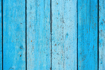 Fototapeta na wymiar blue old wooden background with cracked paint, parallel boards