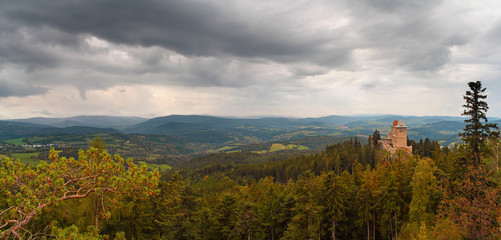 Kasperk Castle (Karlsberg) - autumn landscape with medieval royal castle on hill in woods, cloudy sky, southwestern Bohemia (Czech Republic)