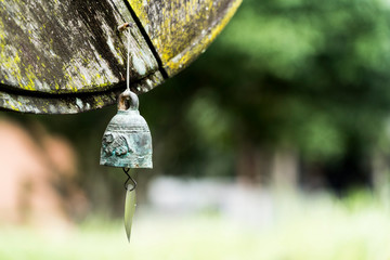 small metal bell with blur background