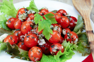 cherry tomatoes in vinaigrette on a plate