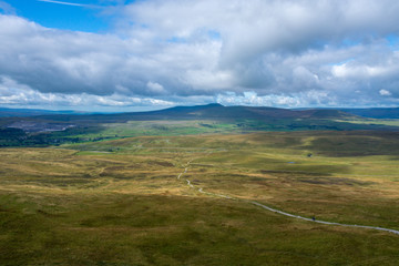 Fototapeta premium Amazing views of the meadows with a sunny day and Yorkshire Mountain