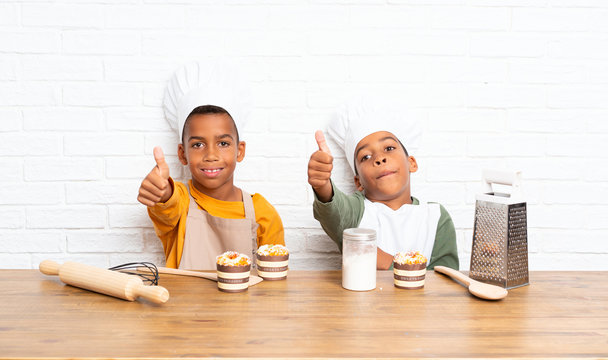 Two African American Brothers Kids Dressed As Chef With With Thumb Up