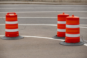 traffic barrier barrels in the parking lot