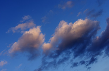 The fluffy dark clouds on the cloudy day