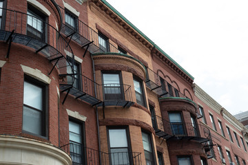 Beautiful brick brownstones displaying a variety of beautiful and ornate architectural details....