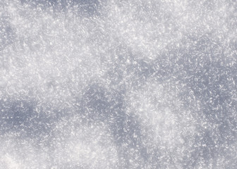 Snow surface with frozen snowflakes on it.