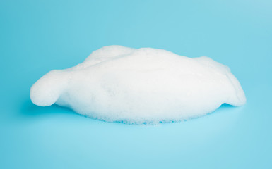 Soap foam bubble isolated on blue background object beatuy health care concept