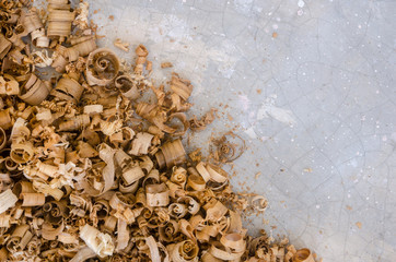 The empty space for copy text with wood sawdust or wood shavings in gray background. Close up view...