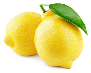 Two whole yellow lemons with green leaf isolated on white background. Lemons citrus fruit with...