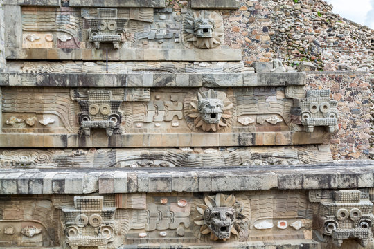 Architectural details with dragon head sink drain of  Mesoamerican pyramids and green grassland located at at Teotihuacan, an ancient Mesoamerican city located in a sub-valley of the Valley of Mexico