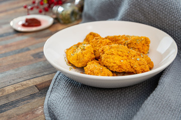Chicken Wings Spicy chicken wings, breaded, fried, cooked.