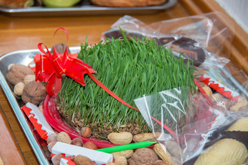 Shakerura is in the background Xoncha . Isolated shot of Novruz holiday cookie shekerbura . Navruz Nowruz holiday, the spring New Year holiday.