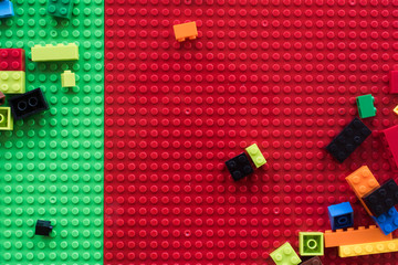 Fototapeta premium Background of random colored plastic construction blocks or brick toy. Concept of education, development and growth.