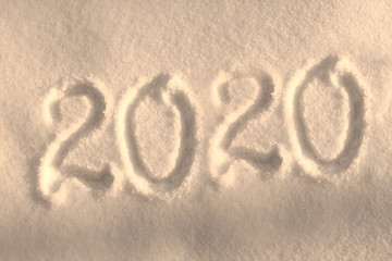 Abstract Christmas photo for beautiful Christmas card with background inscription 2020 on real white snow in winter in cold weather