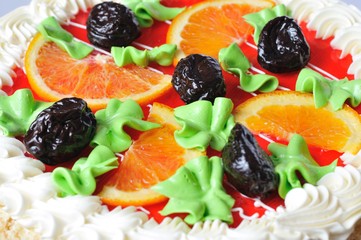 Homemade orange cake with slices oranges and prunes