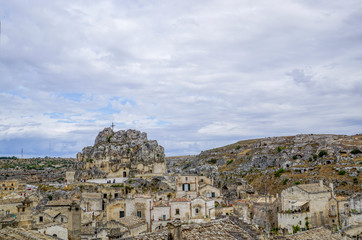 Fototapeta premium 01_A look at the characteristic cliff and the cave church Madonna de Idris, Matera, Italy.