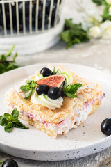 Pavlova on a biscuit with a gentle curd cream and fruit.