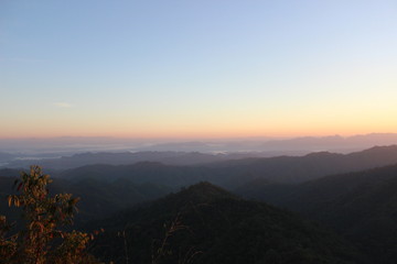 Fototapeta na wymiar Beautiful Landscape of mountain layer in morning sun ray