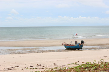 Fototapeta na wymiar A working fishing boat on the beach