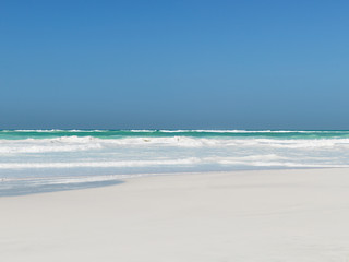 sand beach crystal clear water blu sky