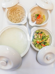 Patient meal service in hospital, served with white ceramic bowl and plastic tray.