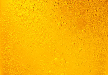 Bubbles on beer background. Oil drop shape on yellow background.Golden circle bubble water pattern.