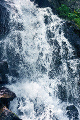 spray and jet of a waterfall