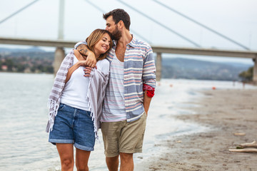 Happy couple hangout at the city beach.