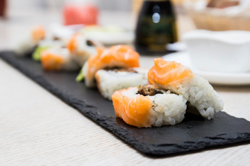 Philadelphia roll sushi with salmon, prawn, avocado, cream cheese. Sushi menu. Japanese food.fresh sushi rolls with salmon and philadelphia cheese