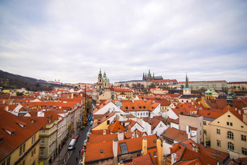 Fototapeta na wymiar View of orange roof tiles of houses in Prague, Czech Repyblic