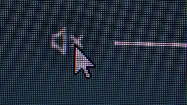 Clicking the volume mute icon in a computer screen monitor, closeup macro showing each individual pixel