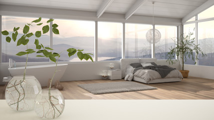White table top or shelf with glass vase with hydroponic plant, ornament, root of plant in water, branch in vase, house plant, modern bedroom with bathtub background, interior design