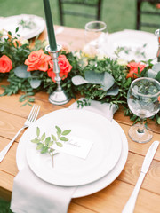 Table setting for an event party or wedding reception. Table settings for a luxury wedding. Outdoor...