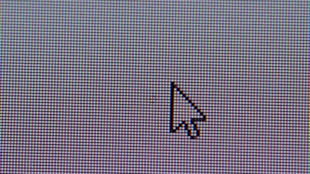 Clicking the minimize button in a computer screen, closeup macro showing monitor individual pixels
