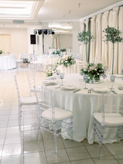 Table settings for a luxury wedding reception. Outdoor wedding