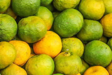 Heap Bunch of Oranges Fruit Fresh From Farm Yellow and Green Color in Market Decoration and Sale