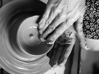 Making Ceramic Molds: Hands molding pottery. Mugs made of clay