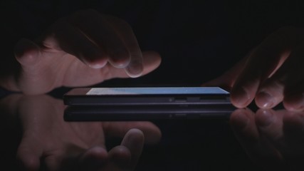 Image with Businessman Finger Accessing Cell Phone Applications