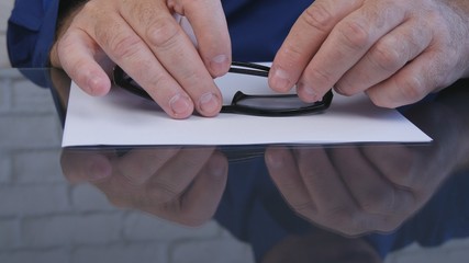 Businessman with Glasses in Hand and a Contract for Sign on the Table