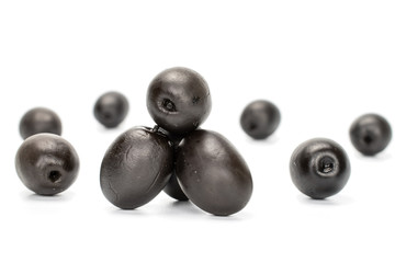 Lot of whole canned black olive isolated on white background