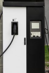Modern electrical fast charger to hybrid automobiles. High technology charger for green way of driving PHEV. Ecology friendly charger. New generation of environmental friendly green petrol station.