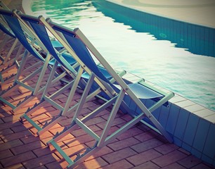 deck chairs by the pool of the spa