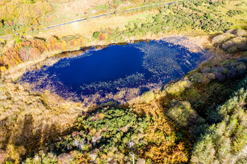 Aerial of lake in a peatbog by Clooney, Portnoo - County Donegal, Ireland
